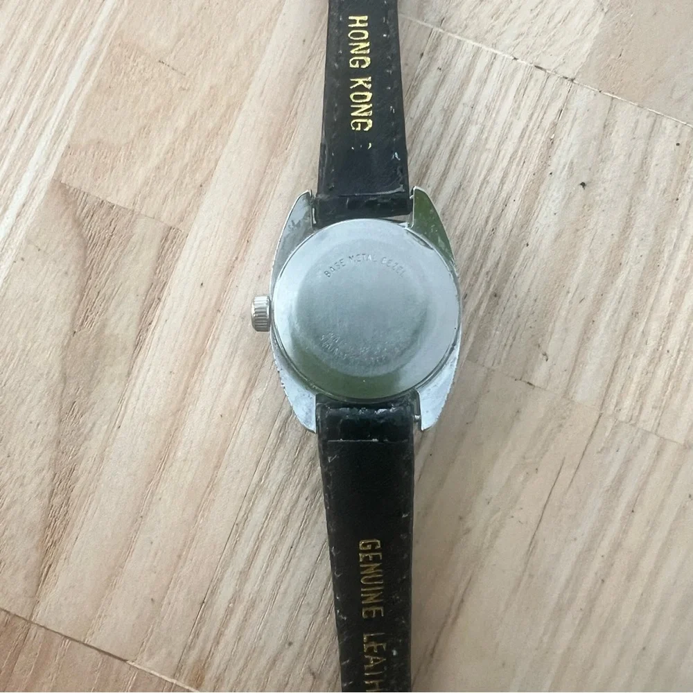 Vintage Timex ladies silver tone black leather mechanical Winding dress watch